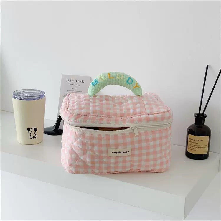 Stylish pastel checkered cosmetic bag for toiletries and beauty essentials
