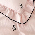 Girly room decor featuring soft pink ruffled bedding set