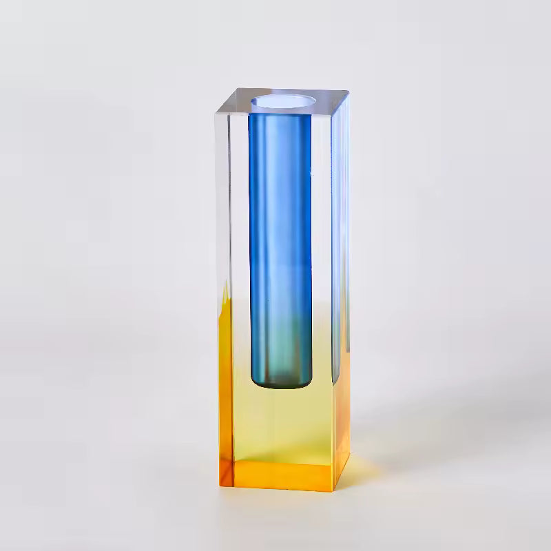 Tall, gradient glass vase with blue at the top and yellow at the bottom on a white background