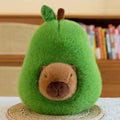 Cute capybara toy peeking out of soft avocado plush pillow