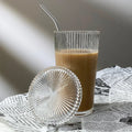 Durable glass tumbler with ribbed texture and lid