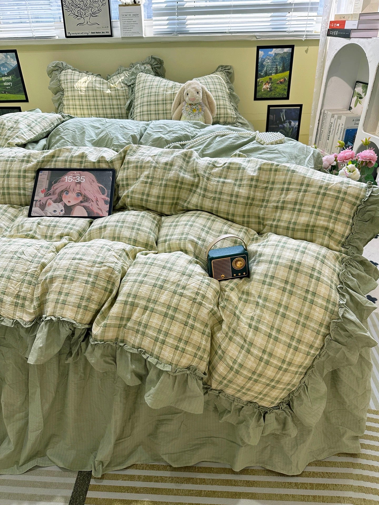 Green plaid bedding set on a bed with decorative items.