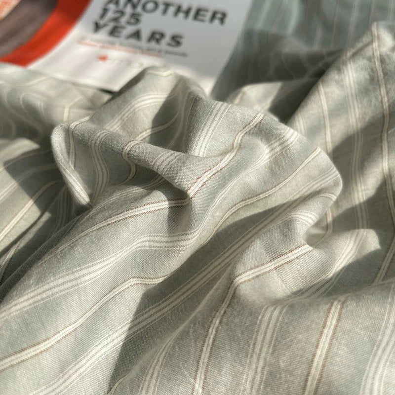 Close-up of gray striped fabric with a blurred background