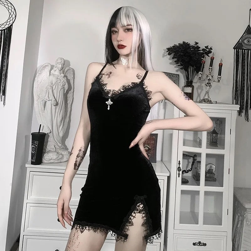 Gothic witch mini dress in black velvet with lace trim. Sexy spaghetti strap design with high-waist slit for Halloween or party events.