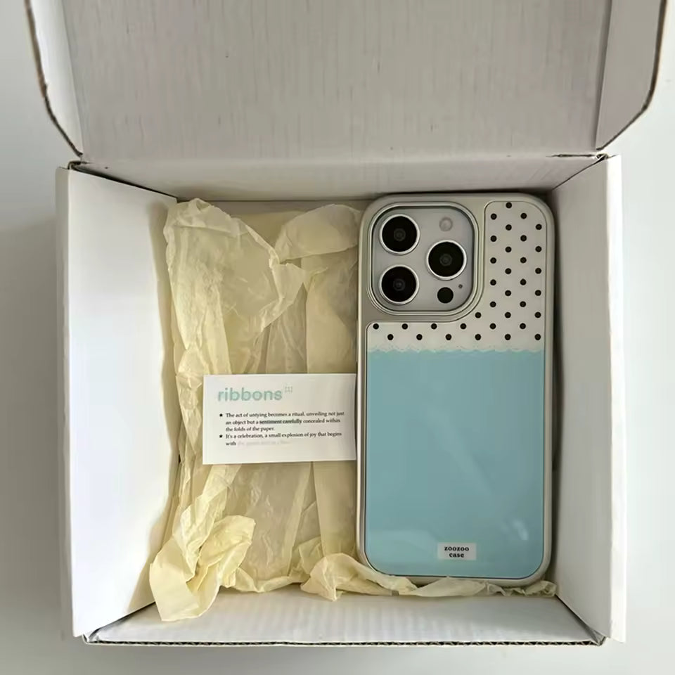Phone case with polka dot design in a box labeled 'ribbone'.