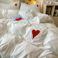 Teen girl's bedroom styled with coquette aesthetic bedding and matching accessories.
