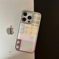 Close-up of pastel glossy phone case with Y2K pattern blocks and dreamy symbols