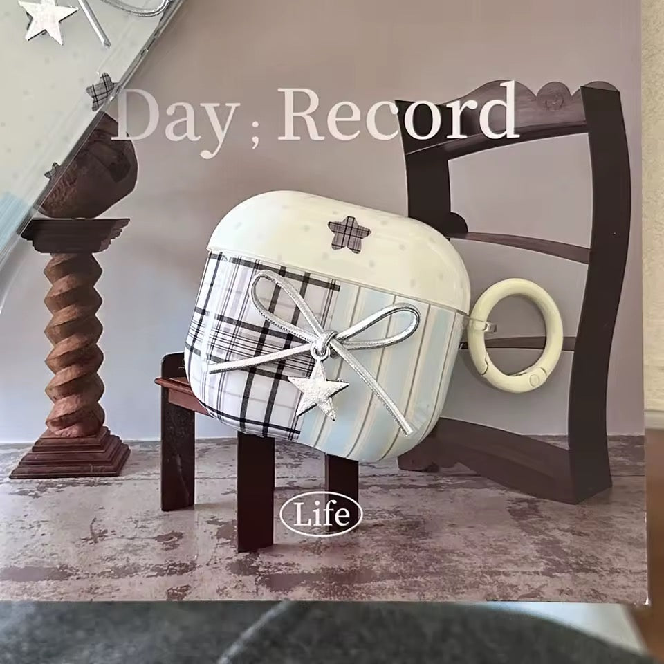 Decorative item with plaid pattern and star design on a wooden stand, with 'Day Record Life' text.