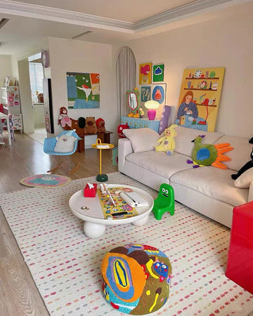 Children's playroom with toys and furniture on a patterned rug