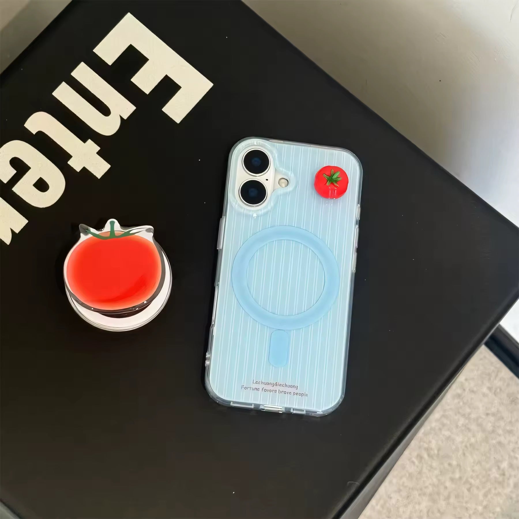 Tomato case for iPhone 16 shown in close-up view.