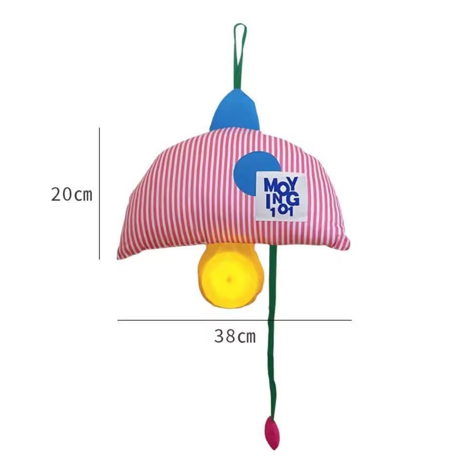 Colorful toy with a red and white striped hat and yellow light bulb, featuring the brand 'Moying'.