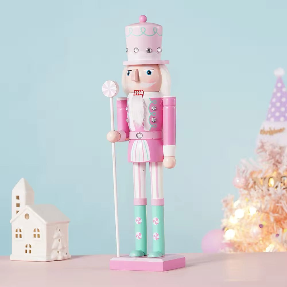 Wooden nutcracker figurine with vibrant candy-themed colors. Perfect for holiday tree ornaments or Christmas home decor.