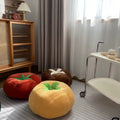 Plush red tomato pillow with green stem