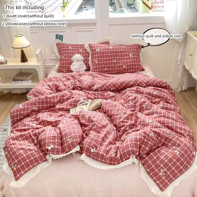 Close-up of lace-trim red checkered bedding set for cozy cottagecore decor.