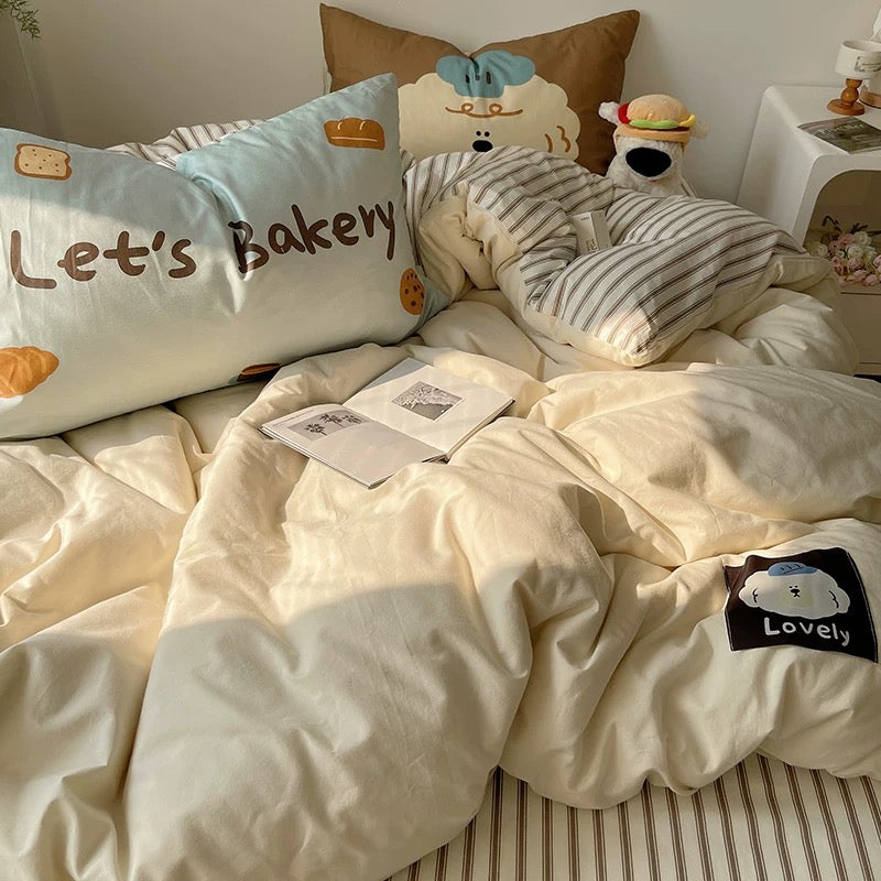 Relaxing girl’s room with warm toned duvet and bakery-themed decor