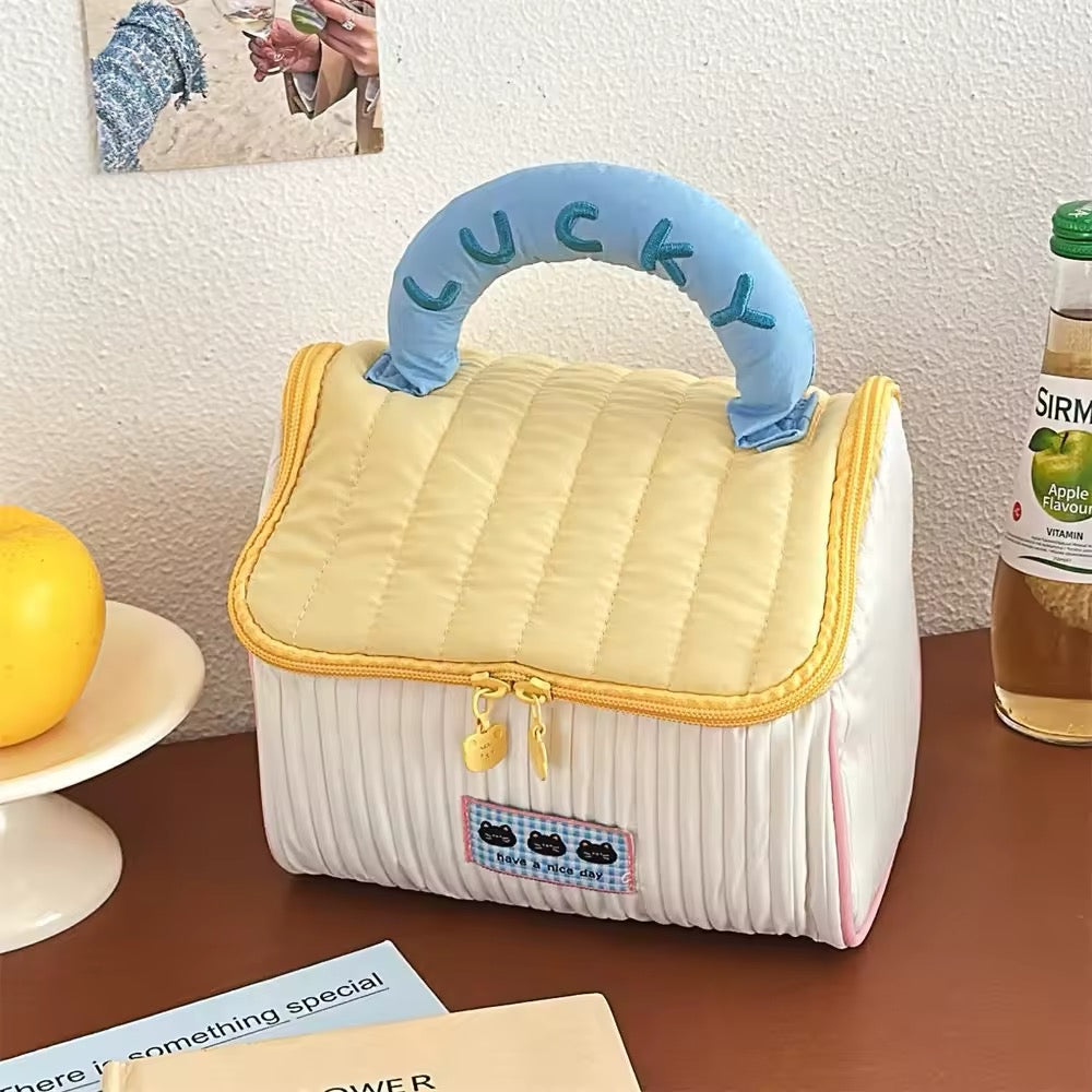 Kawaii makeup bag for kids and teens, featuring house pattern and portable size for travel or school
