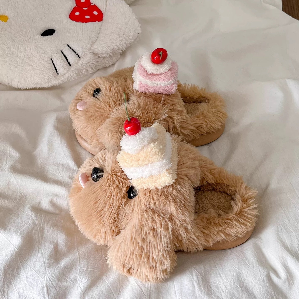 White kawaii dog slippers worn indoors with plush dessert details