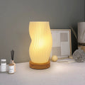 Striped modern bedside desk lamp with USB charging and wooden holder. Elegant pleated lampshade design for Nordic and French cream styles.