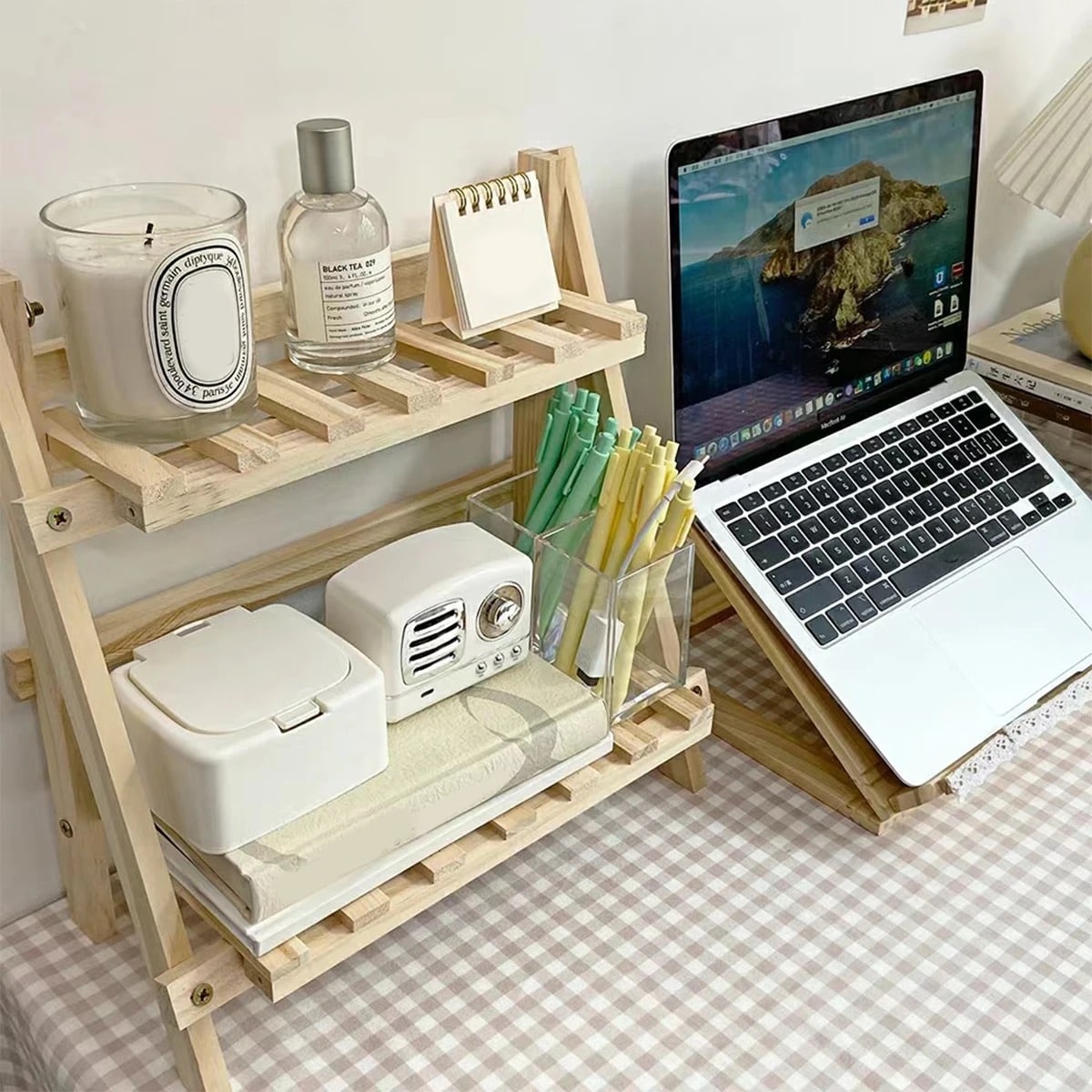 Durable folding wooden storage rack with two-tier design. Perfect for bedroom or living room desk organization.