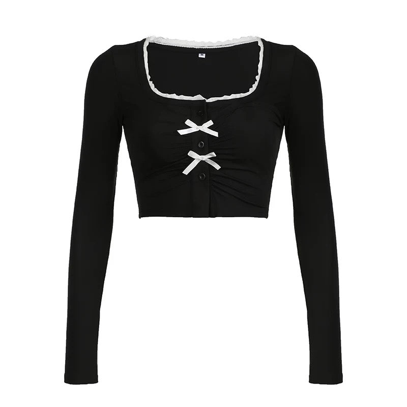 Ruffled chest coquette top with bow tie detail for a feminine touch
