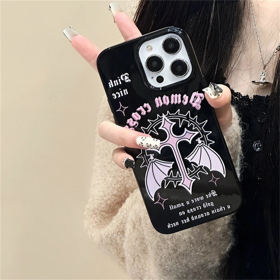 Vintage gothic iPhone case with Y2K grunge design. Black rubber cover with pink wings for iPhone 11, 12, 13, 14, and 15 Pro Max.