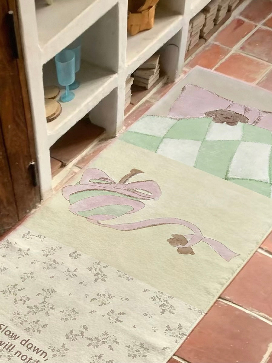 A yellow bedroom rug with green checks and pale floral artwork lies flat beside open shelving.